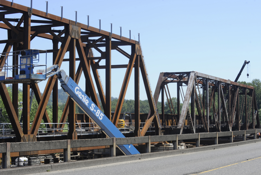 A glimpse of "before and after" is seen here in the BNSF rail bridge that crosses the Washougal River in Camas. On Monday, June 5, workers removed the final piece of the 110-year-old bridge (pictured here on the right) and prepared to place a new crossing to match the first half of the truss bridge (pictured on left) that they installed ealier this month.
