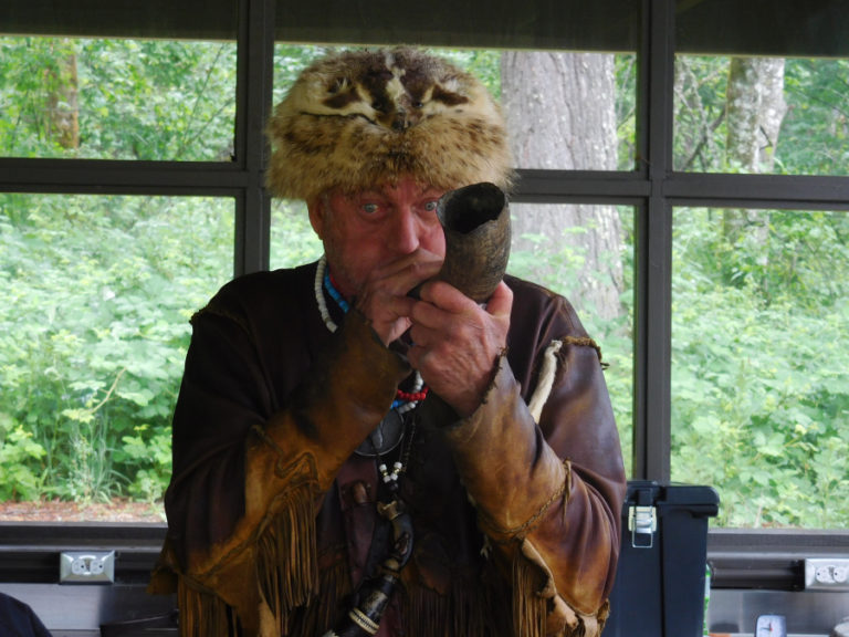 Local historian Roger Wendlick demonstrates how to use the type of horn that Lewis and Clark used to communicate during the Corps of Discovery expedition.