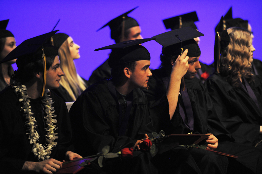 Newly-minted EHS graduates listen intently as Superintendent Mike Stromme declares that they have officially earned their diplomas. 
