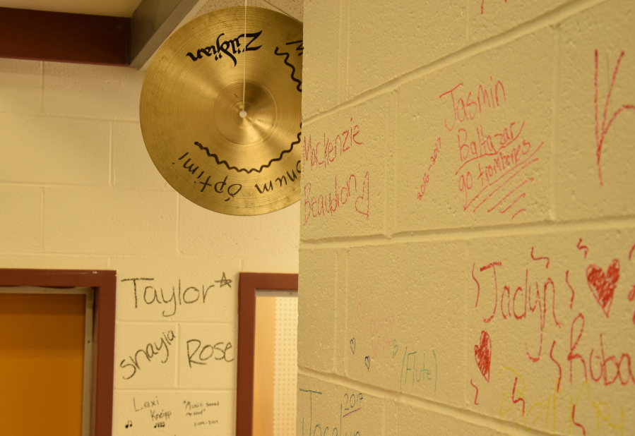 Students and Alumni of Jemtegaard Middle School's band made their last mark on the band room walls before the building was to be demolished. (Photo by Tori Benavente/Post-Record)
