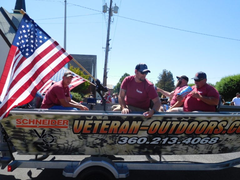 Veteran Outdoors, a national 501(c) 3 non-profit all-volunteer organization that honors U.S. wounded veterans’ patriotism and their sacrifice by providing quality adventures, participated in the Camas Days Grand Parade, Saturday. As the Northwest outreach coordinator for Veteran Outdoors, retired Staff Sgt. John Kaiser, of Camas (left), takes veterans fishing throughout the year. Veterans from throughout the U.S. will arrive for a fishing and reunion weekend in Camas and Washougal, Sept. 7-10.