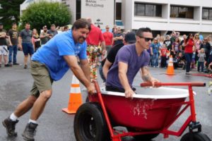 One of two three-person teams from Lutz Hardware competes in the 2016 Camas Days Bathtub Races. Both of the Lutz teams dominated the competition last year, taking first and second place in the races. This year, Aaron Lutz is going to be out of town and the hardware store will only have one three-person team, so competitors will vie to see if they can topple the reigning champion. The bathtub races start at 1 p.m., Saturday, at the corner of Fourth Avenue and Franklin Street in downtown Camas.  (Post-Record file photos)