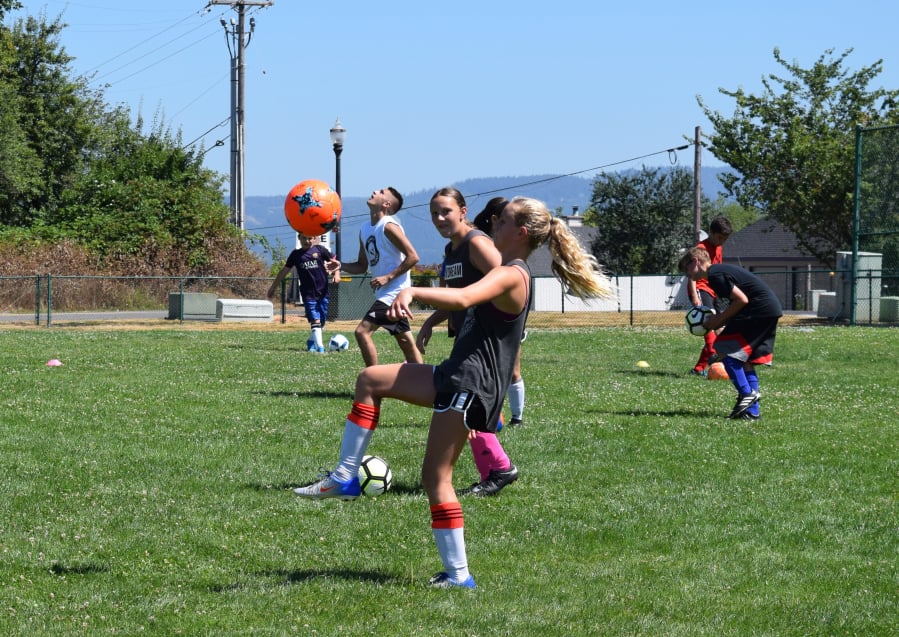 The players take time to practice soccer dribbling and technique at Macaya Soccer Camp on Tuesday, July 25. (Photo by Tori Benavente)