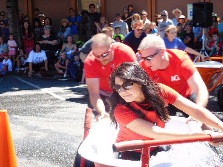 The iQ Credit Union bathtub race team featured Dawn White, Jerime Maloney and Richard Gooch. iQ placed second overall in the Camas Days bathtub races Saturday, in downtown Camas.