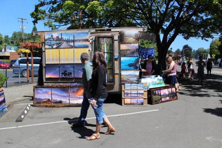 Visitors to the 2017 Camas Days celebrations in downtown Camas walk by the Imagine Anything Traveling Art Gallery, out of Sandy, Ore., on Friday, July 21.