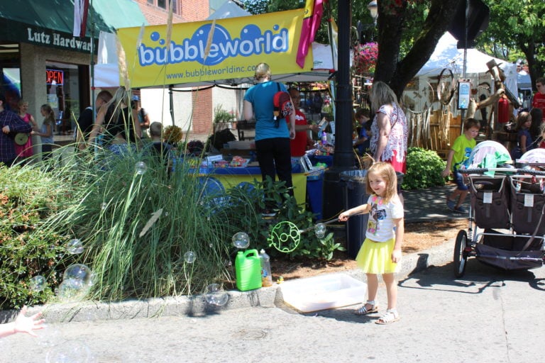 Charli Rose Kruse, 4, plays with the bubble makers at the Bubbleworld vendor booth in downtown Camas on Friday, July 21 during the first day of the 43rd annual Camas Days celebration. Charli Rose is the daughter of Camas Police Officer Ward Kruse and his wife, Sabrina, who were also out enjoying the festivities on Friday. 