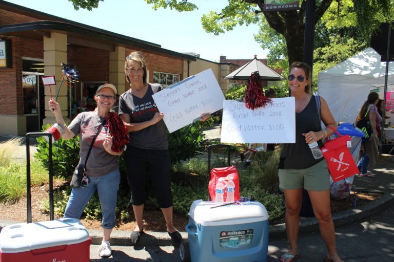 Support Camas High's Grad Night with a $1 bottle of cold water. These Grad Night supporters are out at Camas Days in historic, downtown Camas on Fourth Avenue today through Sunday.