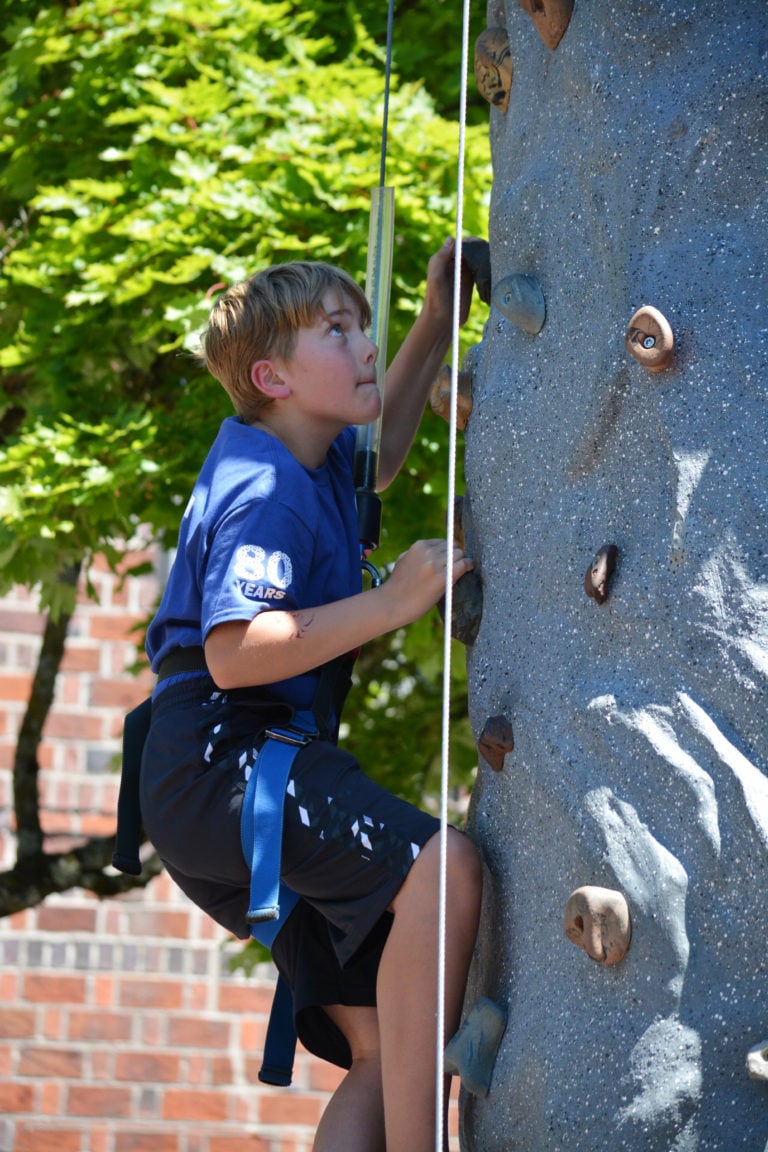 Climbing the rock wall at Camas Days.