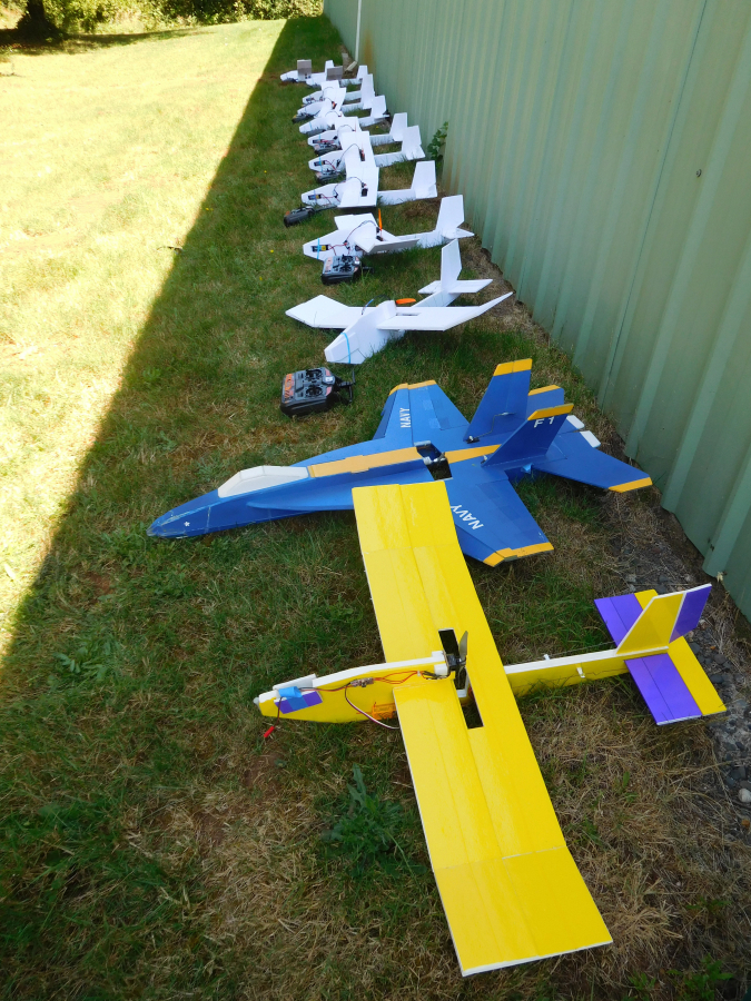 Above: Students added engines to their remotely piloted model airplanes on the last day of a five-day aviation camp for students ages 9 to 14, held at Grove Field Airport.