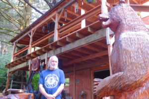 Carver Ken Craig built much of his Washougal home himself, using reclaimed douglas fir and cedar boards. He describes it as a "work in progress." Placed beside his home are various carvings he has created over the years.  Craig turned his passion for carving into a career of sorts after moving to Washougal 10 years ago.
