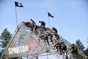 More than 6,000 men and women answered the Spartan call Saturday, at Washougal Motocross Park. This 4.2-mile sprint featured 24 obstacles of hills, rope climbs, weight carries, ring swings, barbed wire, tire flips, a spear throw and plowing through muddy water. 