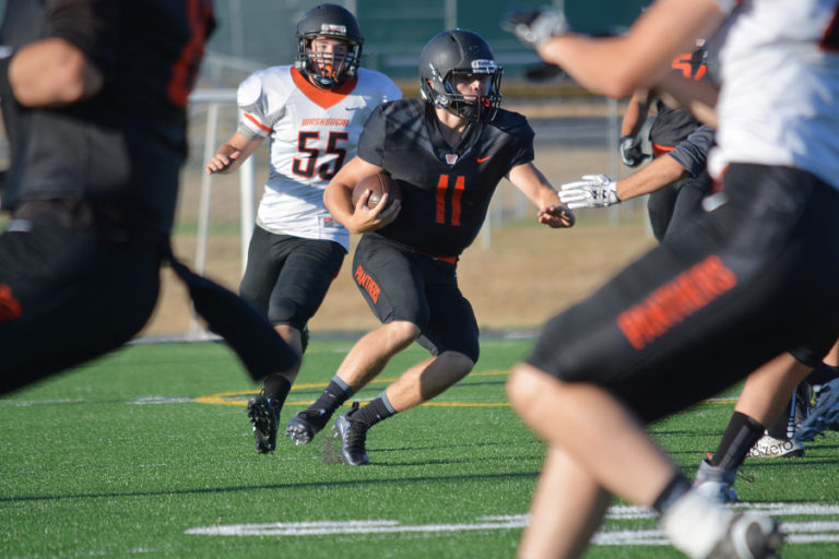 Washougal quarterback Ryan Stevens sees a lot of teammates to throw to and defenders to watch out for during the Black and Orange scrimmage game.