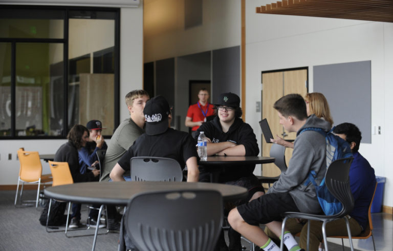 Excelsior High School students gather during lunchtime at their new building, which replaced the old, drafty portables.