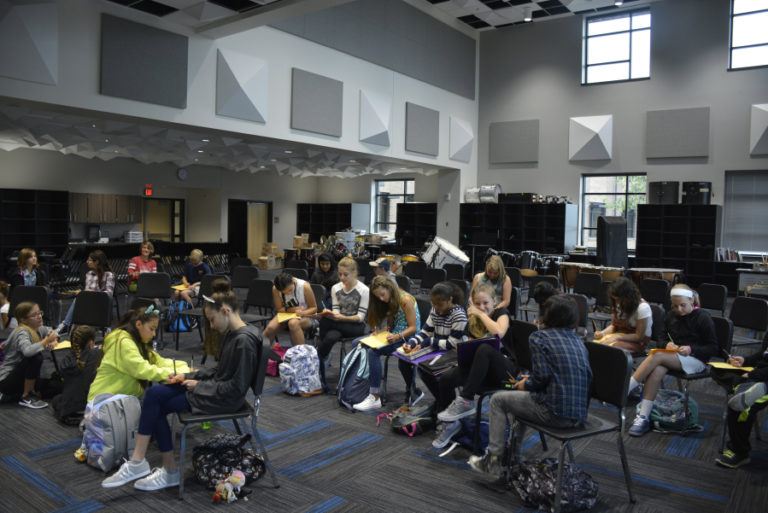 Students take notes on the first day of class in Jemtegaard Middle School&#039;s music room.