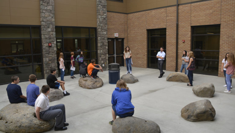 The new JMS building includes a courtyward. Boulders that were on the land during construction now line the area and can be used as natural chairs.
