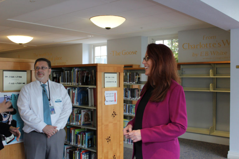 Washington Secretary of State Kim Wyman (right) is pictured here with Camas Library Support Assistant Christopher Knipes (left) at the Camas Public Library, on Tuesday, Sept. 19. Wyman says the book Charlotte&#039;s Web helped her learn to love reading as a young girl.