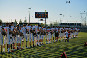 Camas High School football players stand for the National Anthem Friday, at Hillsboro Stadium. The defending Washington Class 4A state champions then defeated Oregon 6A state runner-up Central Catholic 35-13 in the first game of the 2017 season.
