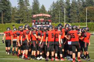 Wearing red tops for the first time in a decade, the Camas High School football team scored 28 points in the first quarter and never looked back. The Papermakers defeated A.C. Davis High School, of Yakima, 52-19 Friday, at Doc Harris Stadium.