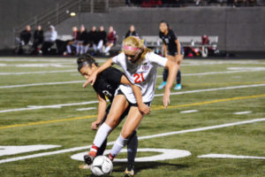 Camas sophomore Liz Parker gets tangled up with a Union Titan Tuesday, at Doc Harris Stadium. After 90 minutes of soccer, the Papermakers and Titans settled for a 1-1 tie. 