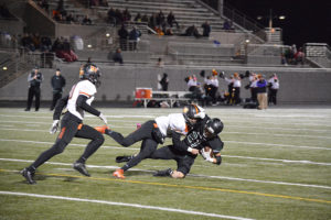 Washougal's Ryan Stevens chops down Woodland's Tyler Flanagan for a loss of eight yards during the 2A Greater St. Helens tiebreaker Monday, at Doc Harris Stadium. Columbia River defeated Woodland and Washougal for the No. 2 playoff seed. Woodland took the No. 3 seed and Washougal settled for No. 4.