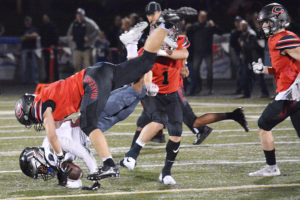 Camas High School senior football players Taylor Adams and Trevor Bentley bring down a Union Titan Friday, at Doc Harris Stadium. Union scored two touchdowns in the fourth quarter to defeat Camas 14-13 for the 4A Greater St. Helens League championship.