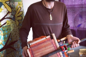 Washougal artist John Furniss works in his woodworking studio in 2017. (Contributed photo courtesy of John Furniss)