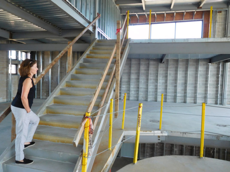 Kimberly Sherertz, owner of the &quot;Black Pearl&quot; building, stands between the second floor and the mezzanine of the structure at 56 S. ?A? St., Washougal.