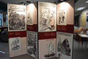 Library assistant Fran McCarty filled out a grant to get the "Herblock on Democracy" exhibit on display at the Washougal High School Library. It features several political illustrations from the past that McCarty feels are still relevant today. 