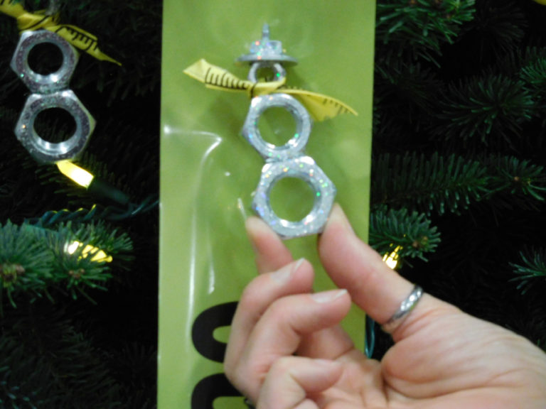 Ornaments on the 2016 Washougal Festival of Trees&#039; construction themed tree included gift cards, a level, gloves, measuring tape, framed construction photos and these unique ornaments made from nuts and bolts.