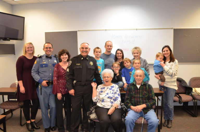 Washougal Police Sgt. Brad Chicks celebrates with family members who attended his retirement celebration on Nov. 20, at the station.