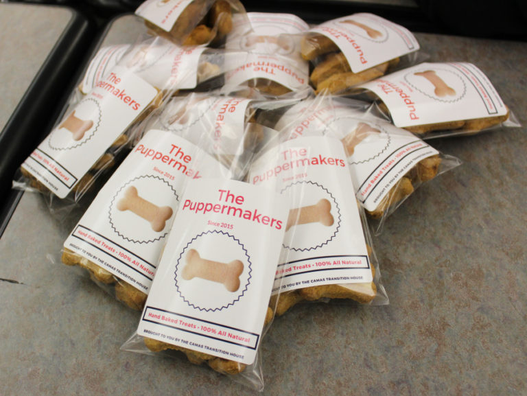 Finished bags of &quot;Puppermakers&quot; dog treats start to stack up in the Camas High DECA room on Friday, Nov. 17. Young adults from the Camas School District&#039;s Transition House will sell the treats at local bazaars and festivals to raise money for their group&#039;s outings and other special events.