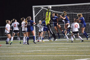Camas goalkeeper Falissitie DePasquale and the Papermakers defend the goal in the final minutes of a first round of state match against Bellarmine Prep. (Post-Record file photos)
