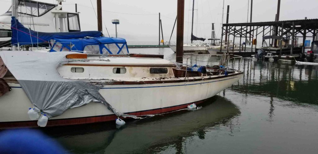 A view of a boat that was next to the one that burned Tuesday, Dec. 26, at the Port of Camas-Washougal marina. Port employees have set up an absorbent boom in the Columbia River to catch any contaminants. Port of C-W Facilities Manager Jeramy Wilcox said some oil or fuel, from the burnt boat, has been cleaned from the boat launch ramp. The boat was towed to the boat launch ramp and placed on a trailer and then taken to the port office parking lot to complete extinguishment. (Photo contributed by Port of Camas-Washougal)