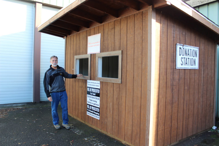 Dave Pinkernell, the president of the Camas-Washougal Community Chest, shows where people can drop off clothing and household goods donations to the Inter-Faith Treasure House, one of the Community Chest&#039;s 20 grant recipients in 2017.