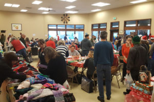 Approximately 160 people attended a free dinner on Christmas Day 2016, in the Washougal Community Center. The third annual event, organized by volunteers, will be held from 3 to 6 p.m., Monday, Dec. 25, at Hathaway Elementary School, 630 24th St., Washougal. Donations of gifts, hygiene items, socks, hats, scarves, stocking stuffers and non-perishable food, are accepted prior to the event. (Post-Record file photo)