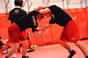 Jack Latimer (left) and Rylan Thompson lock up during wrestling practice at Camas High School. Thompson is a three-time state placer for the Papermakers. Latimer perservered through the J Robinson 28-day wrestling camp in July. 