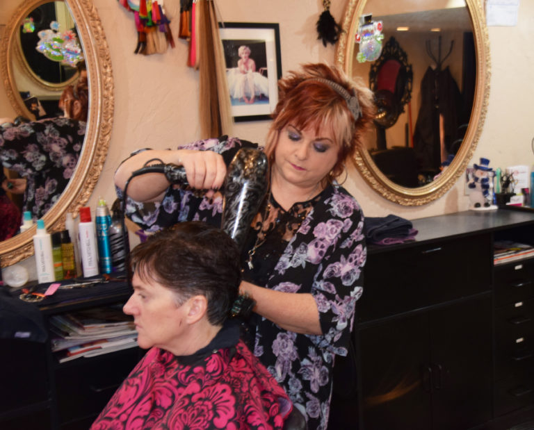 Jyl Straub, owner and stylist at The Wild Hair salon in downtown Camas, finishes client Becky Perman&#039;s &quot;just in time for the holidays&quot; haircut on Dec.