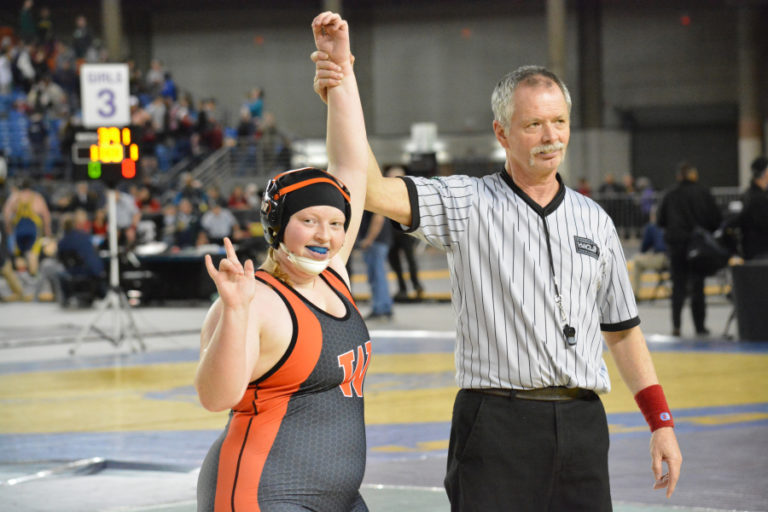 Abby Lees gets her hand raised after winning the 235-pound girls wrestling state championship for Washougal, in February, at the Tacoma Dome.