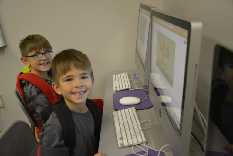 Hathaway Elementary School fourth-grader Carter Boucher (left) and first-grade Ethan Boucher (right) attend the &quot;Hour of Code&quot; event held in early December at their Washougal elementary school.