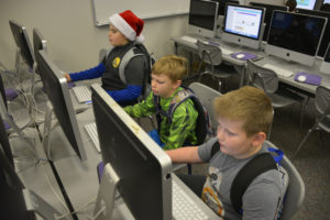 Students at Hathaway Elementary School learn to code during a December "Hour of Code" event. Pictured here, from left to right, are third-graders Cody Jacobus, Ethan Dowl and Kaden Fenne. (Contributed photo by Rene Carroll, courtesy of the Washougal School District)
