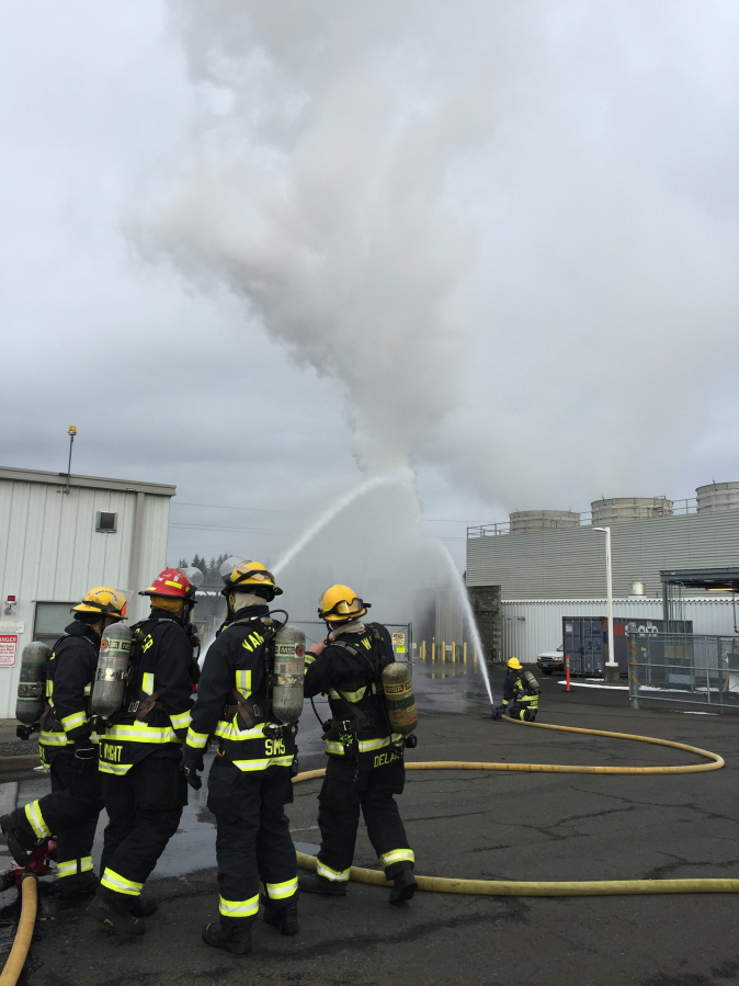 Camas-Washougal Fire Department crews douse a 3,000-gallon hydrogen tank at WaferTech in December of 2016. As Camas grows, especially to the northeast, where new industry is expected to build in the Lacamas North Shore development, city leaders are looking for ways to expand service and cut costs. Partnering with East County Fire and Rescue may be one answer.