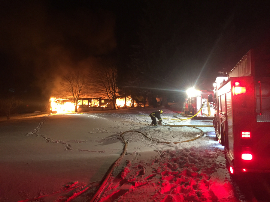 Post-Record file photo 
 Emergency crews respond to a house fire in rural Washougal in January of 2017. A possible consolidation between the Camas-Washougal Fire Department and East County Fire and Rescue could open up more resources in Camas' urban growth boundary, particularly in the North Shore area, which is expected to add thousands of new residents, as well as new businesses and industries within the next 15 years. (Post-Record file photo)