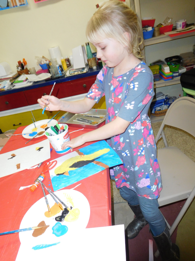 Sophia Buchett, 7, of Washougal, enjoys painting an image of the Washington State bird, an American Goldfinch, during an &quot;Art Across America&quot; class, at Little Chick&#039;s Art Play.