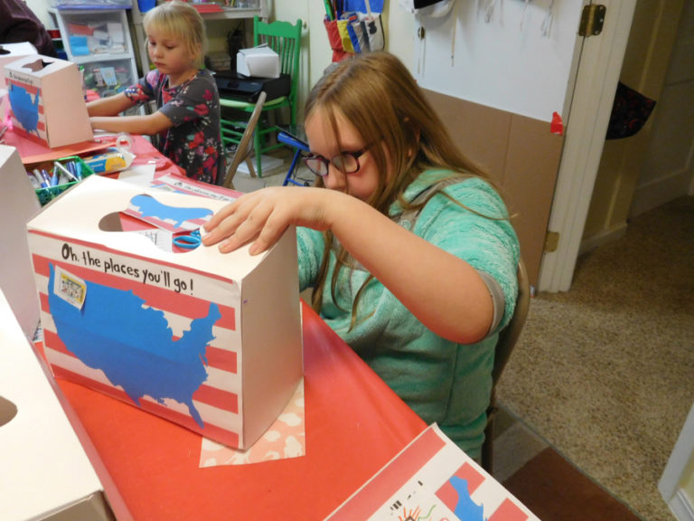 Sophia Buchett, 7, and Megan Kunz, 8, both of Washougal, create dioramas during an &quot;Art Across America&quot; class at Little Chick&#039;s Art Play.
