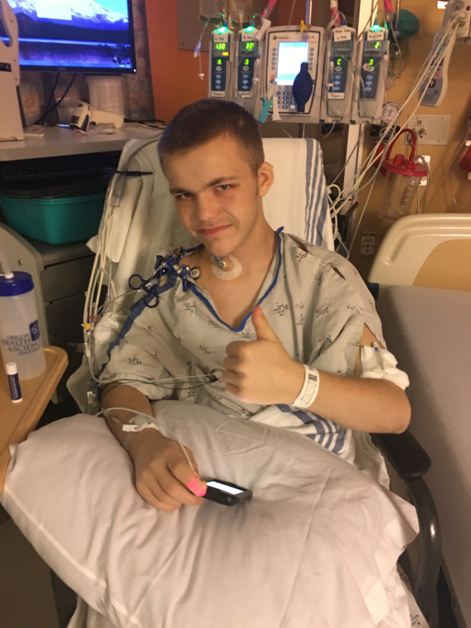 Dakota Watson gives a thumbs up a day after his kidney transplant surgery. Watson was in surgery for about six-and-a-half hours at Doernbecher Childrens Hospital on Thursday, Dec. 14.