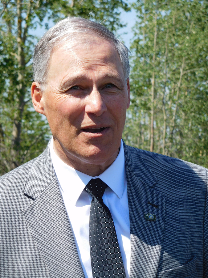 Governor Jay Inslee, pictured here at a May of 2017 visit to Steigerwald Lake National Wildlife Refuge near Washougal, has rejected a controversial oil terminal proposal that would have brought trains bound for the Port of Vancouver, carrying 360,000 barrels of flammable Bakken crude oil, through Camas-Washougal each day.