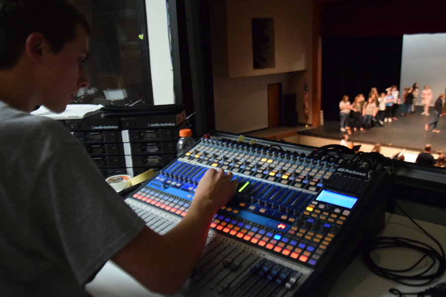 Washougal high school senior Marcus Bennett controls the microphone sounds during a recent rehearsal for the "Annie Get Your Gun" musical at Washougal High School. Bennett said he is on track to study electrical engineering but would like to work with sound engineering too.