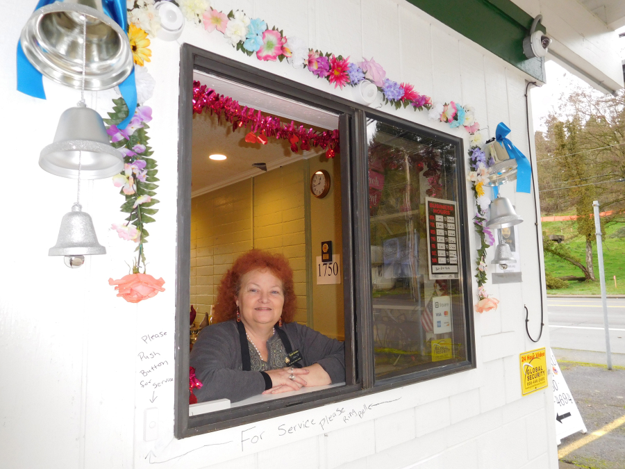 Leslie Rick, owner of Mystic Gardens, a florist in Camas, is an ordained minister who can provide weddings in her business' drive-thru. Weddings can also be held inside the floral shop or on the covered patio. (Photos by Dawn Feldhaus/Post-Record)
