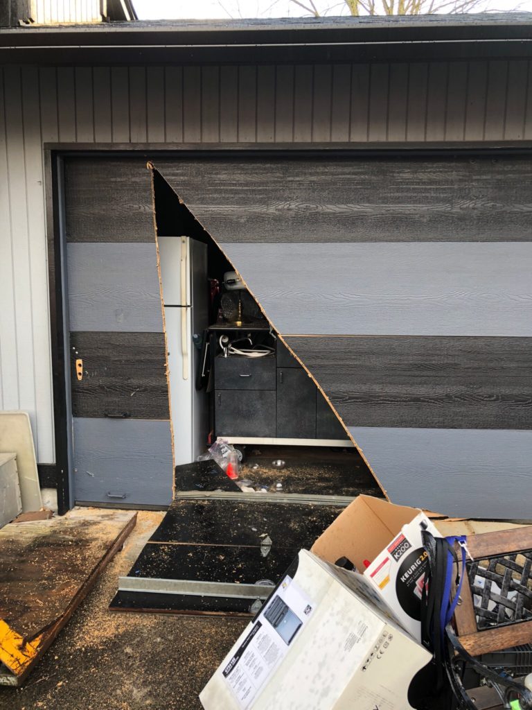 Camas-Washougal firefighters cut into the garage door at a home off Northwest 27th Avenue in Camas on Wednesday, Feb. 14, to rescue a man trapped inside. (Photo courtesy of Camas-Washougal Fire Department)