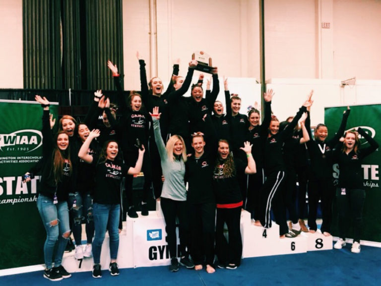 Camas gymnasts celebrate their team&#039;s first-ever state championship win on Feb. 16.